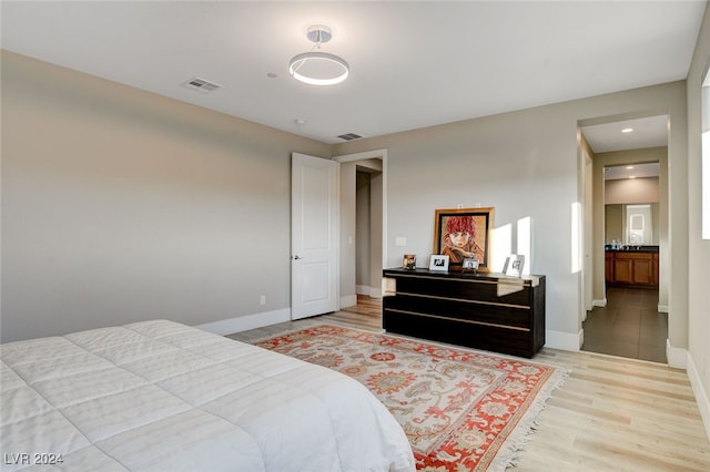 bedroom with wood-type flooring