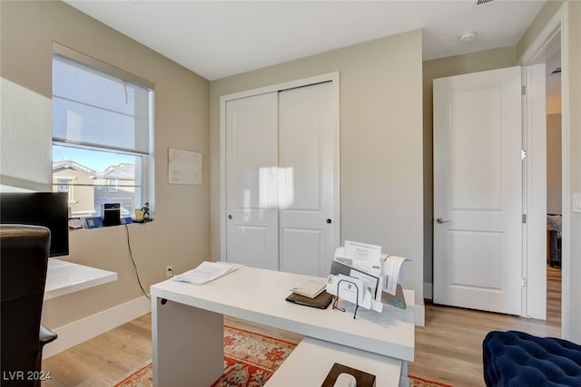 home office with light wood-type flooring