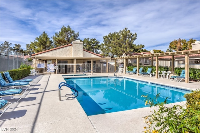 view of swimming pool with a patio