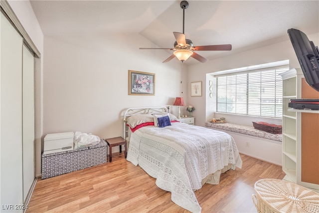 bedroom featuring a closet, ceiling fan, vaulted ceiling, and light hardwood / wood-style floors