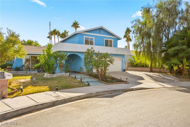 view of front of house with a front lawn and a garage