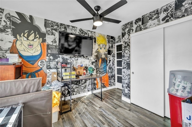 living room with wood-type flooring and ceiling fan