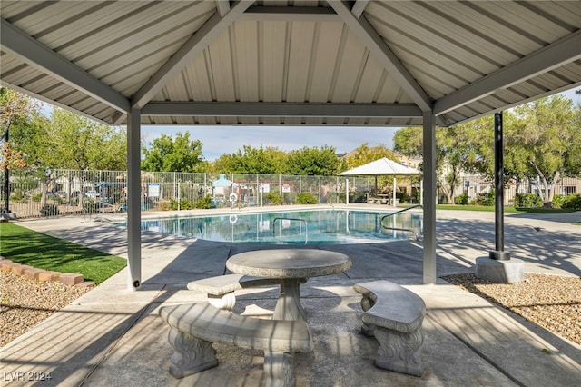 view of swimming pool with a gazebo and a patio area