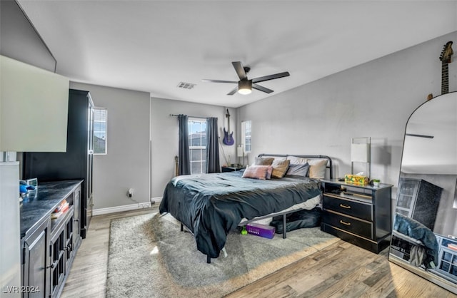 bedroom featuring ceiling fan and light wood-type flooring