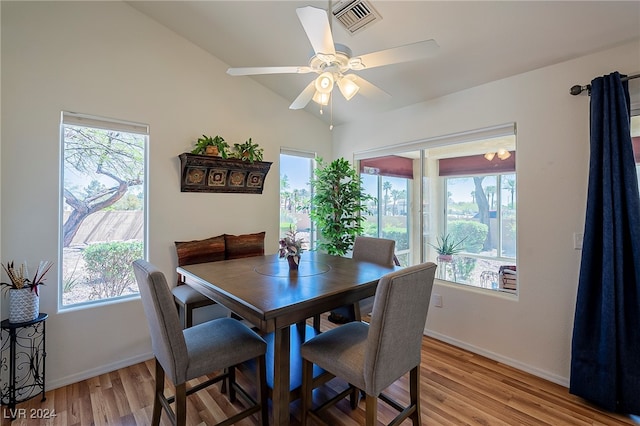 dining space with lofted ceiling, light hardwood / wood-style flooring, and ceiling fan