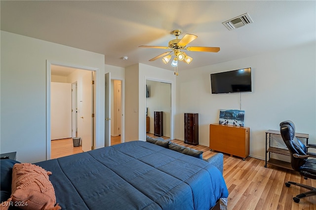 bedroom with light wood-type flooring and ceiling fan