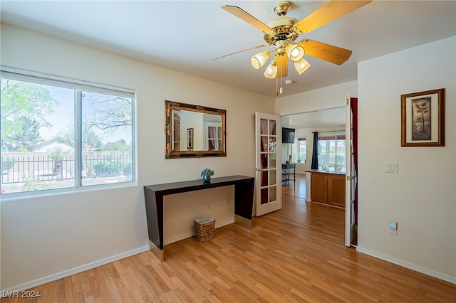 hall with light hardwood / wood-style floors