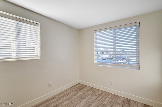 spare room with light hardwood / wood-style floors