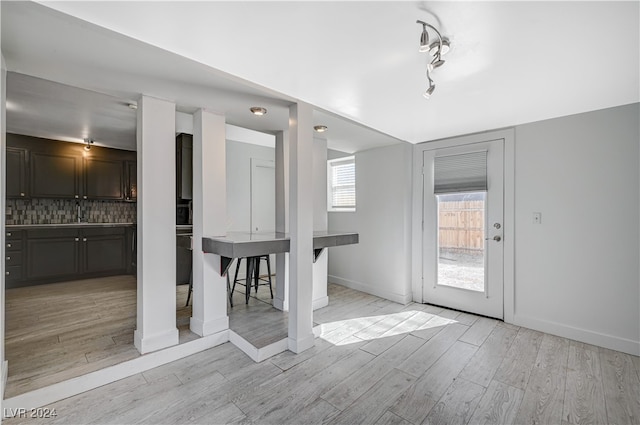 unfurnished dining area with light hardwood / wood-style flooring