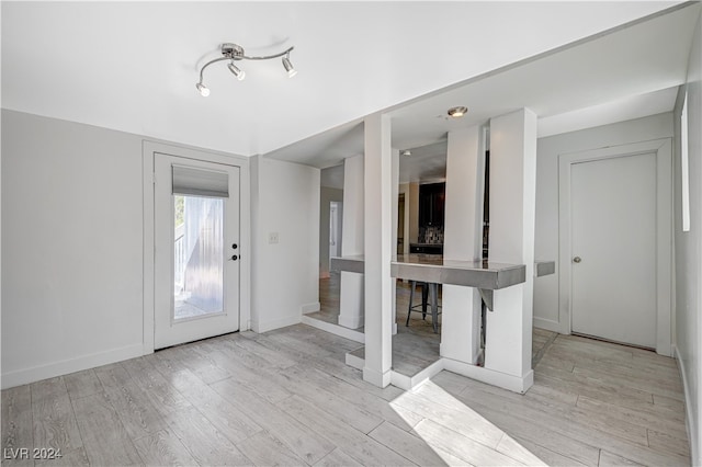 foyer entrance with light hardwood / wood-style flooring