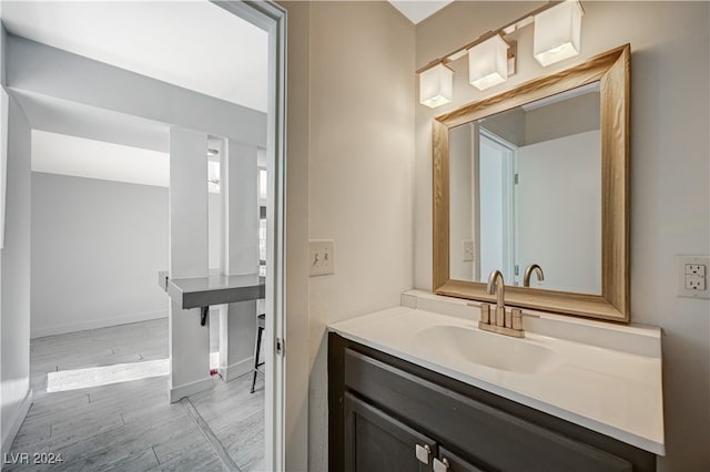 bathroom featuring vanity and wood-type flooring