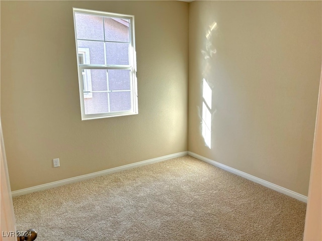 spare room with carpet floors and a healthy amount of sunlight