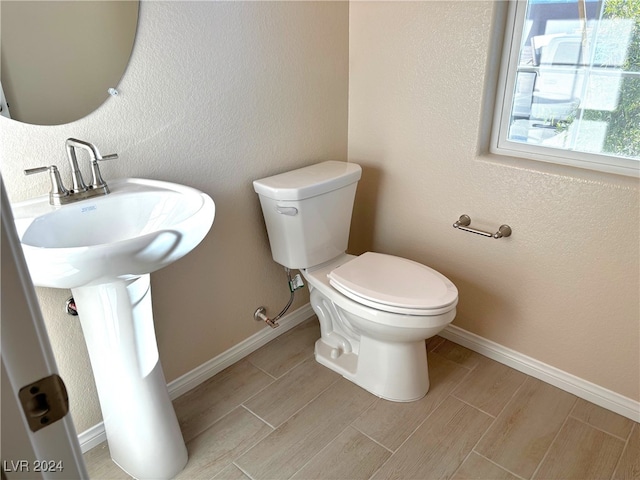 bathroom with sink and toilet