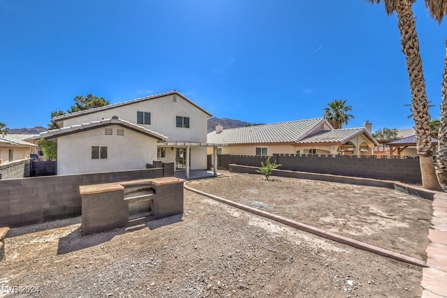 back of house featuring a patio