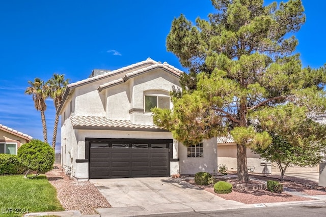 mediterranean / spanish-style house featuring a garage