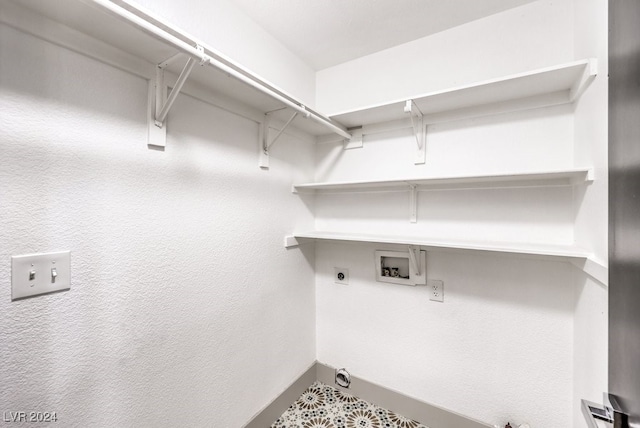 laundry area featuring hookup for an electric dryer and hookup for a washing machine