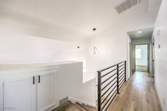 hallway with light wood-type flooring