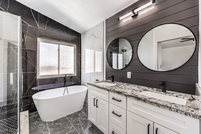 bathroom with vanity, independent shower and bath, wooden walls, and vaulted ceiling