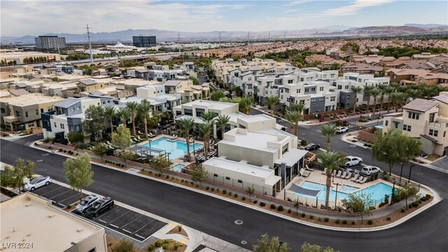 birds eye view of property with a mountain view