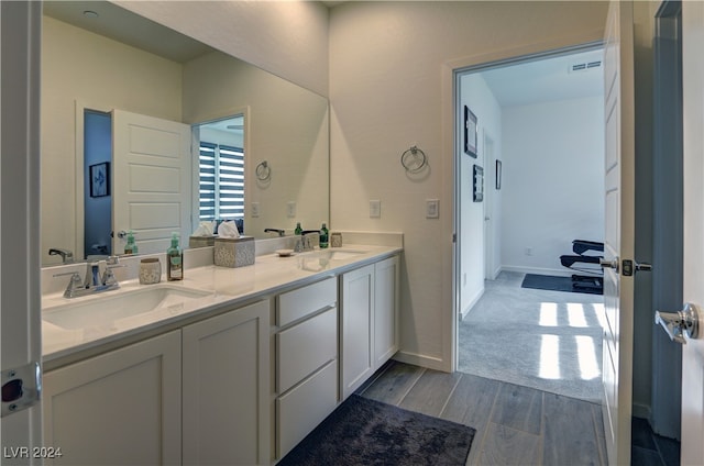 bathroom featuring vanity and hardwood / wood-style flooring