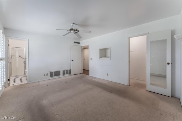 carpeted empty room with ceiling fan