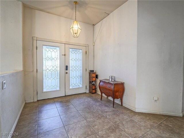 tiled foyer entrance featuring french doors