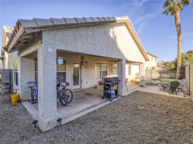 rear view of house with a patio area