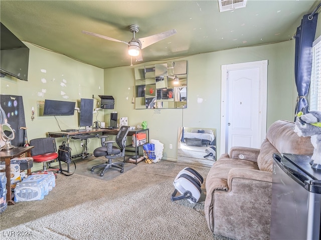 home office featuring ceiling fan and carpet floors