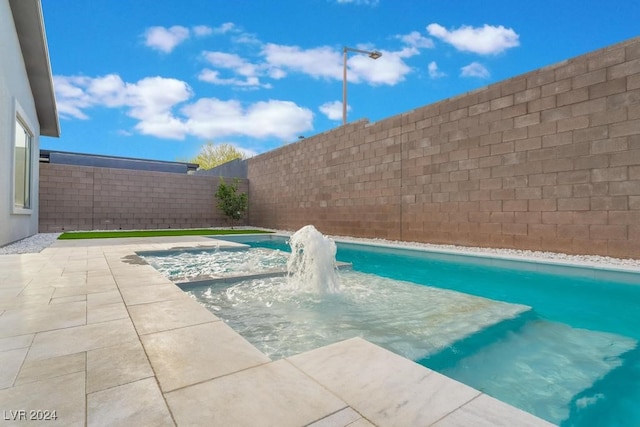 view of swimming pool featuring pool water feature