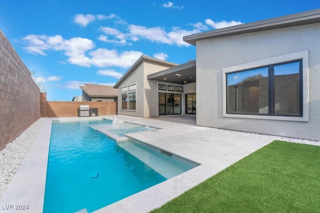 view of swimming pool with a patio