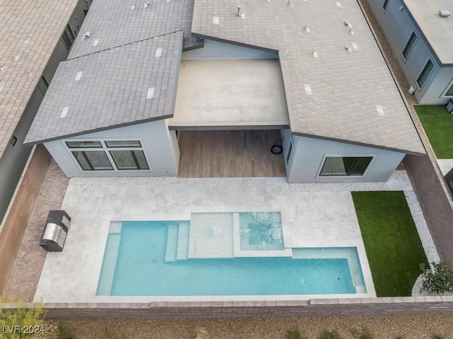 rear view of property featuring a patio area