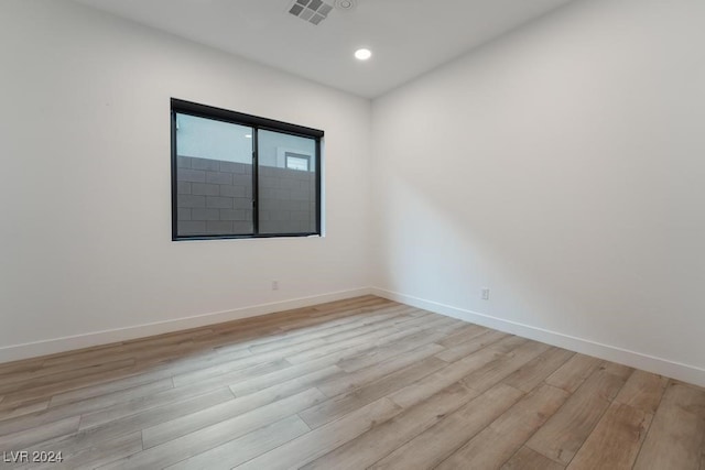 spare room with light wood-type flooring