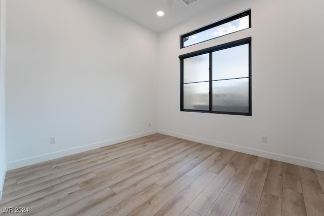 spare room with light wood-type flooring