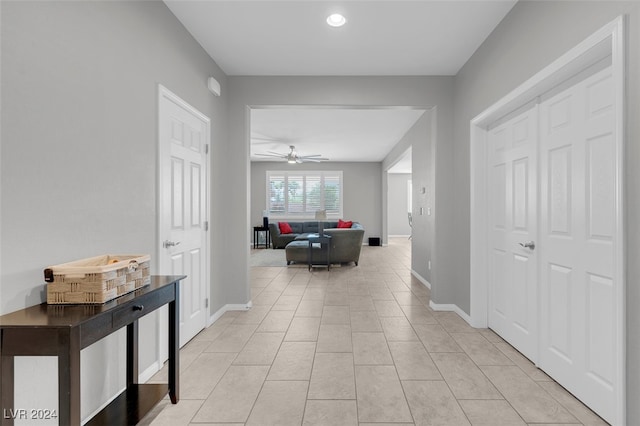 hallway featuring light tile patterned floors