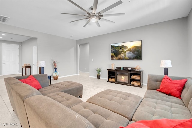 tiled living room featuring ceiling fan