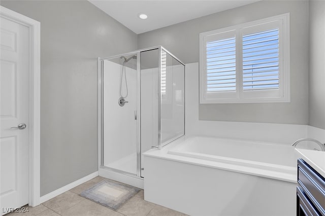 bathroom featuring tile patterned flooring, vanity, and plus walk in shower