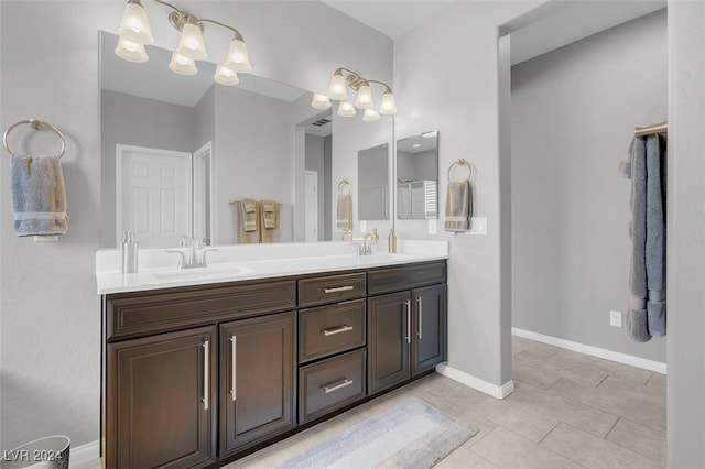 bathroom with tile patterned flooring and vanity