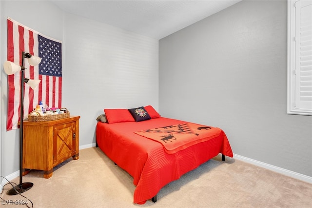 bedroom with light carpet