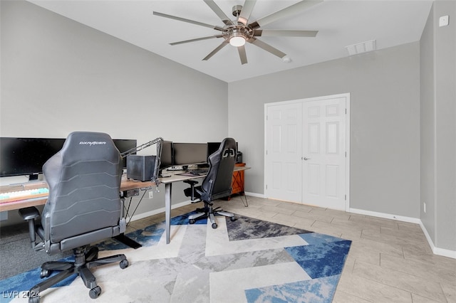 office space featuring ceiling fan and light tile patterned floors