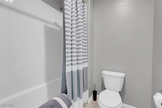 bathroom with shower / bathtub combination with curtain and toilet