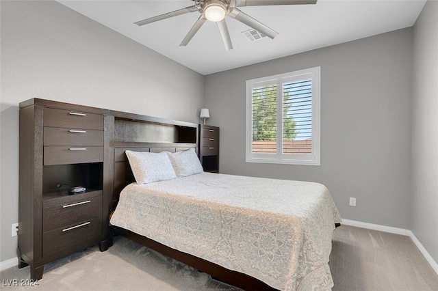 bedroom featuring ceiling fan and light colored carpet