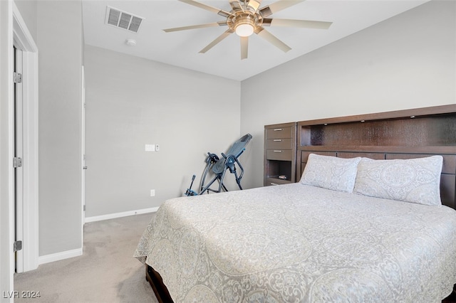 bedroom featuring ceiling fan and light carpet