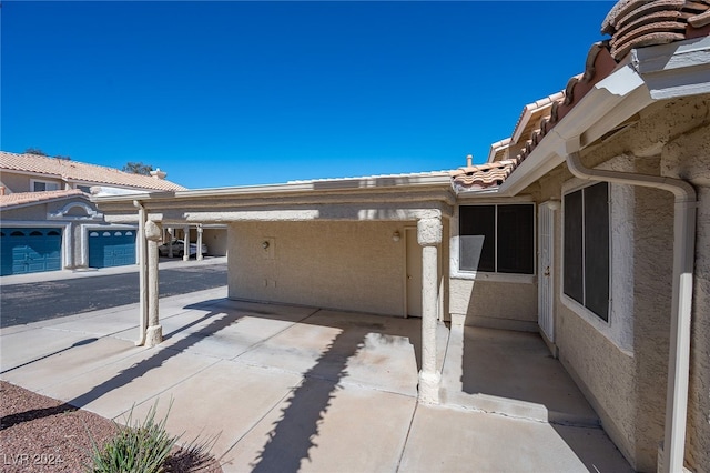 view of patio featuring a garage