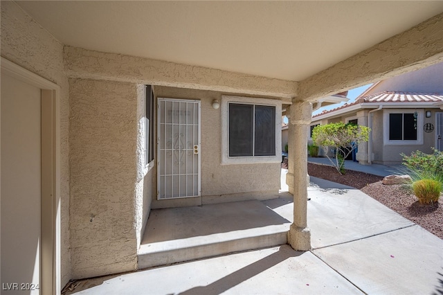 doorway to property featuring a patio area