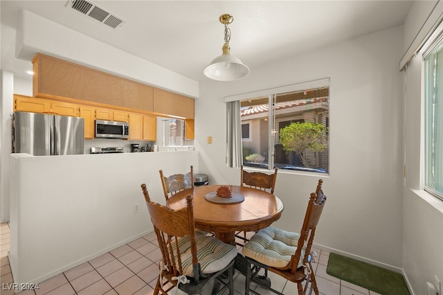 view of tiled dining space