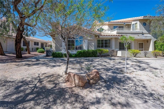 2259 Rugged Mesa Dr, Laughlin, NV 89029 - view of front facade featuring a tiled roof, stucco siding, and a balcony