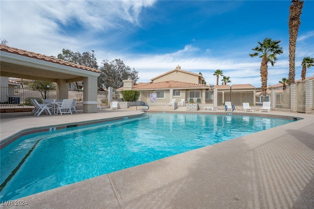 view of swimming pool featuring a patio