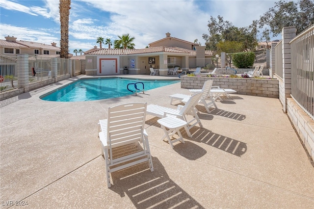 view of swimming pool featuring a patio area