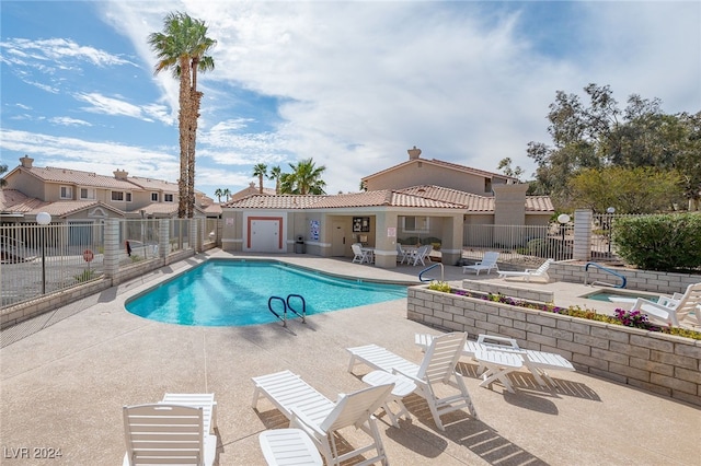 2259 Rugged Mesa Dr, Laughlin, NV 89029 - community pool featuring a patio and a fenced backyard