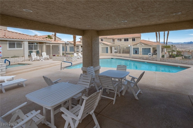 2259 Rugged Mesa Dr, Laughlin, NV 89029 - community pool featuring a patio and outdoor dining area